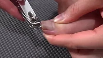 Woman cutting toenails