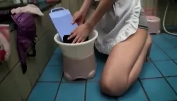 Japanese milf toys her pussy in the shower