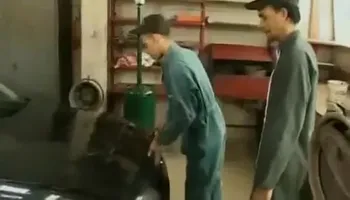 3 mechanics in garage